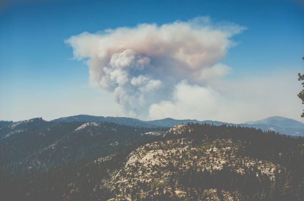 An image of a mountain with smoke from wildfire.